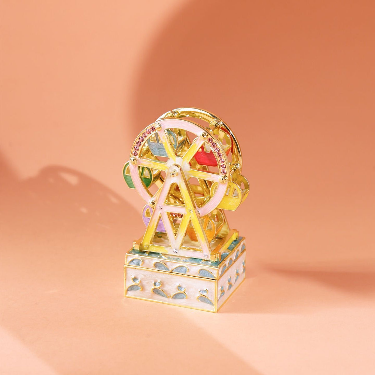 Enameled jewelry box with rotating Ferris wheel ornament, diamond-encrusted handicraft gift.